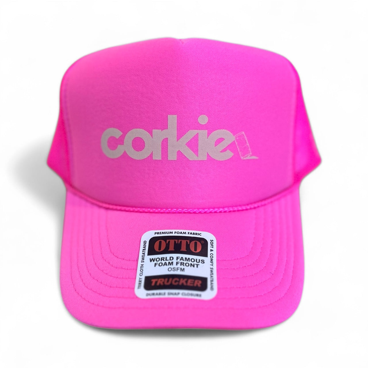 Pink cap with 'corkie' wine lovers branding on a white background